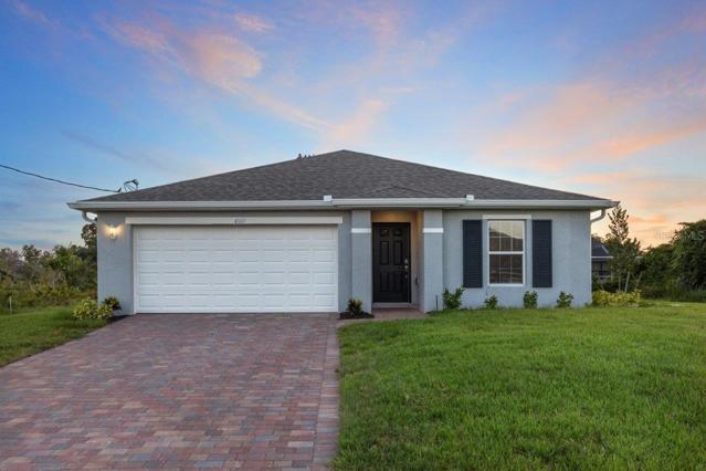 Front Elevation Featuring a Paver Driveway and Walkway
