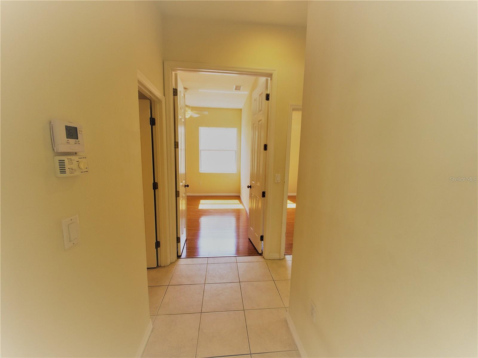 Hallway to 2nd bathroom and bedroom 2 and 3