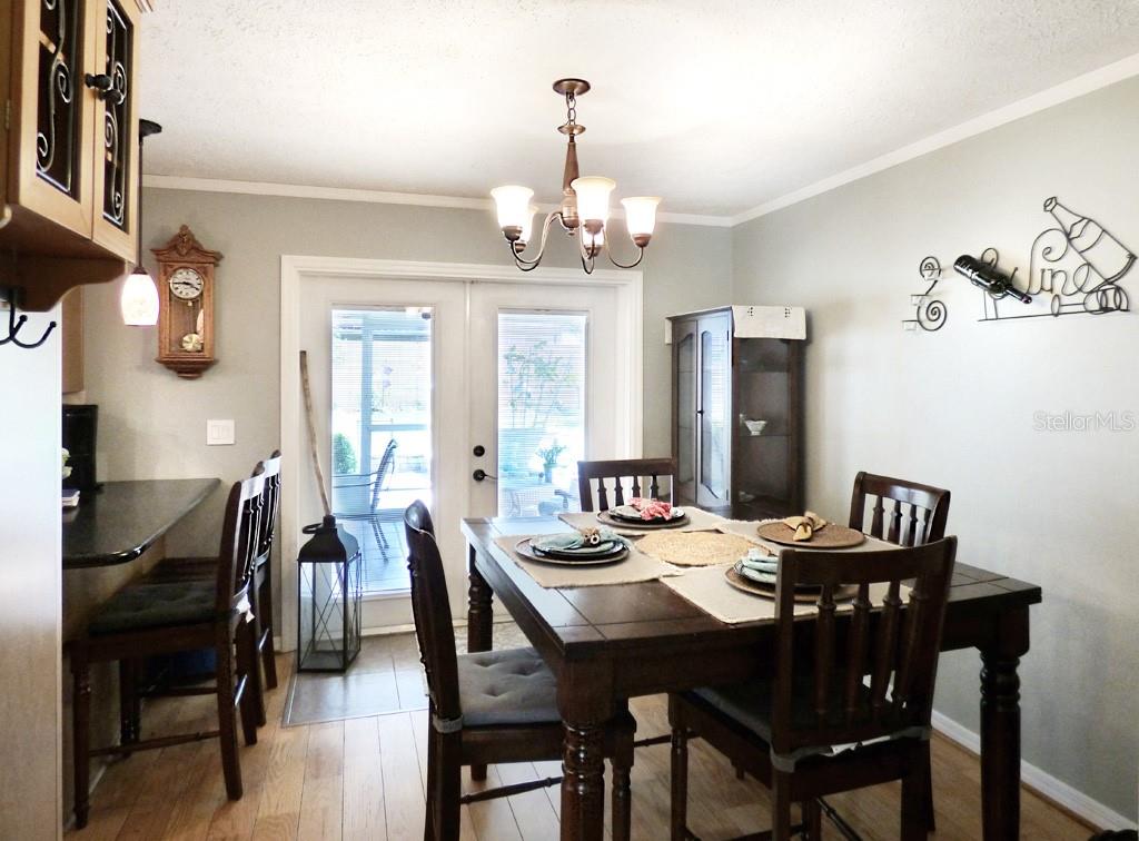 Dining room with French doors to covered, screened lanai