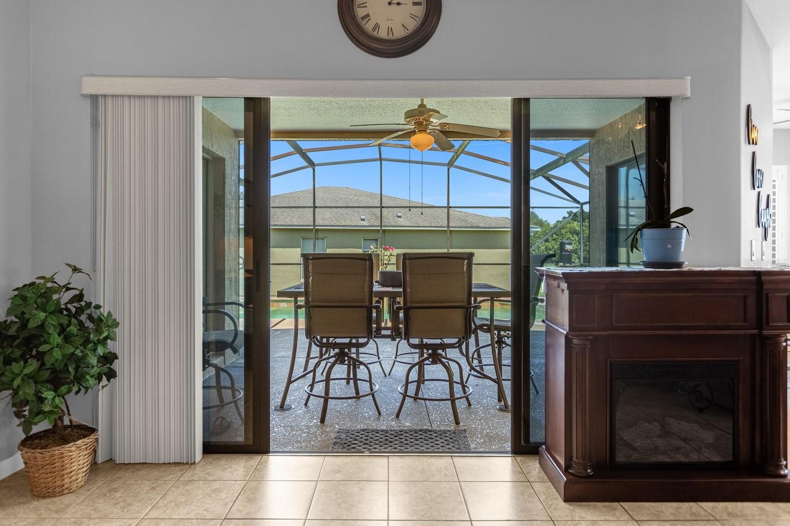 Sliding Doors in The Living Room - That Lead To The Screened in Pool
