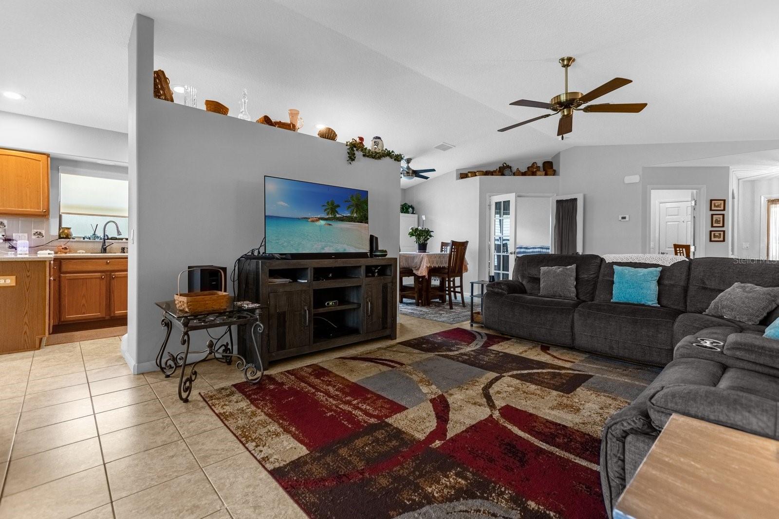 Living Room - Looking Towards The Front Door, Den and Dining Room