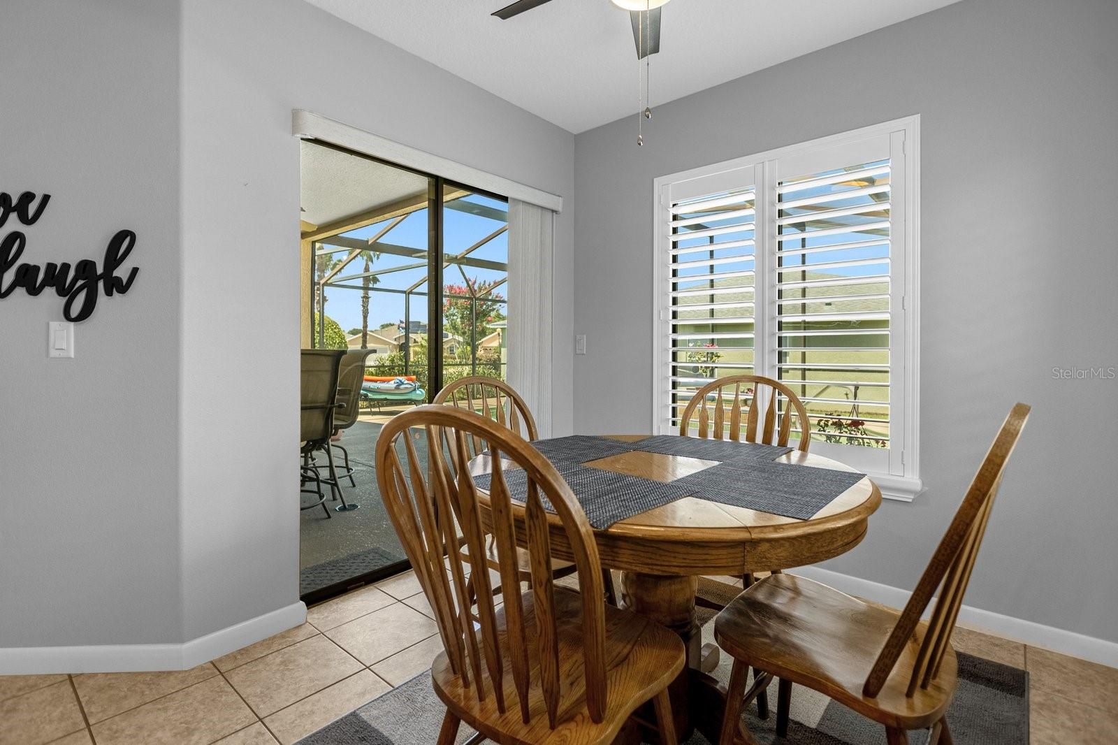 Kitchen Dinette Area - With Sliding Glass Doors To the Screened Pool