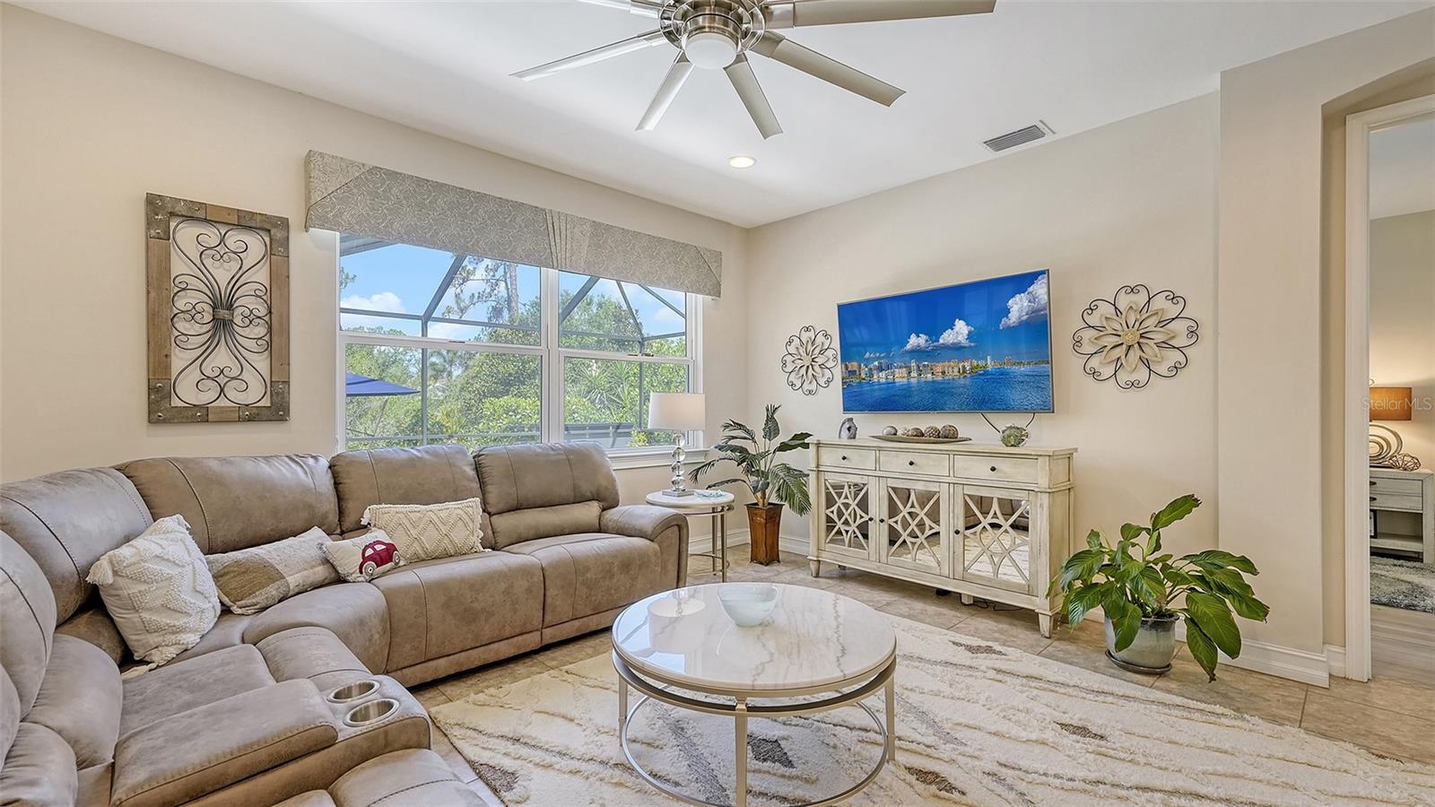 Living room with view to pool and lanai