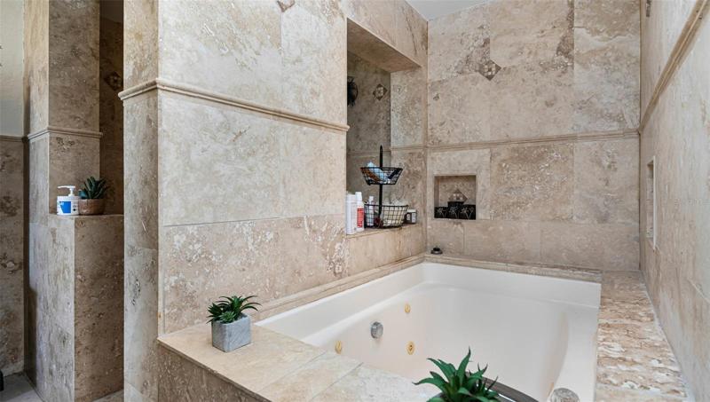 Roma-Spa style deep tub with adjoining walk-in shower