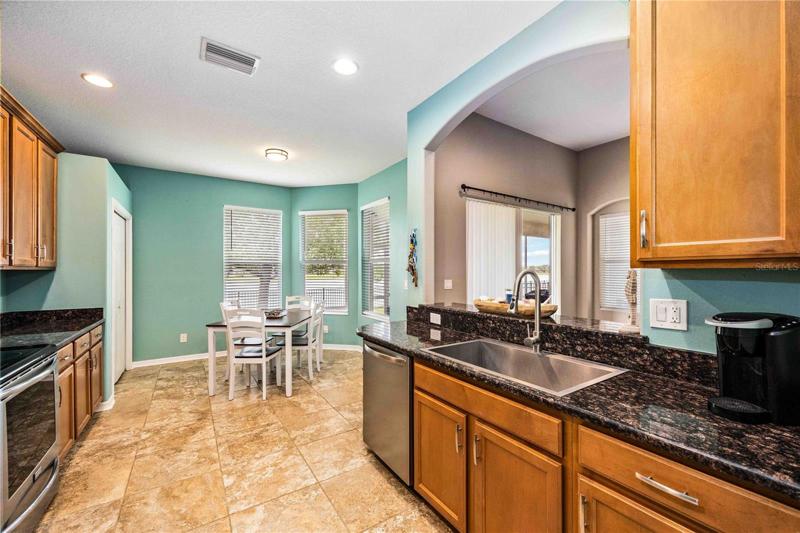 Efficient culinary hub, ample storage, upgraded appliances.