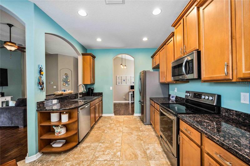 Open-concept kitchen, seamless flow to living/dining