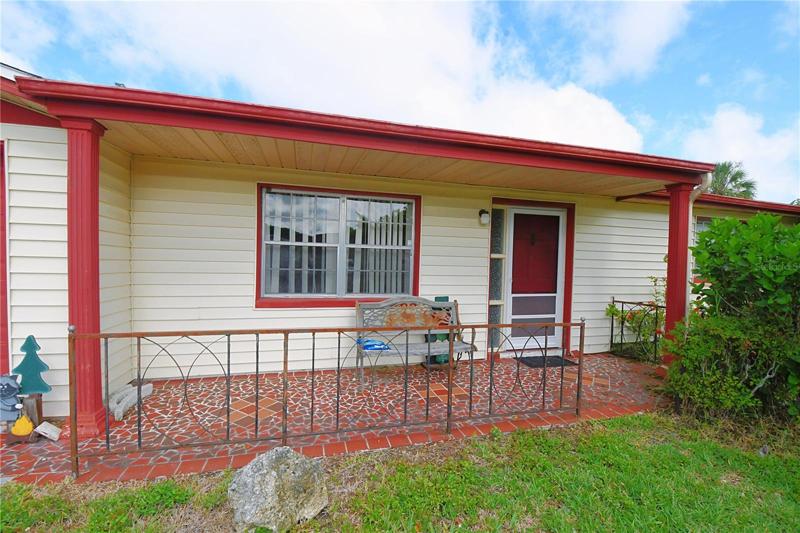 Covered front porch with a Mosaic tile entry.