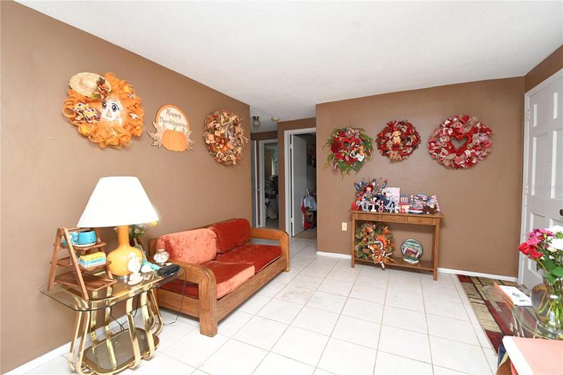 Ceramic tile throughout the living room.