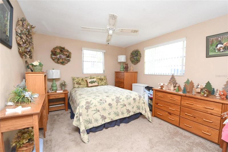 Bedroom 1 has two windows, a large built in closet, plush carpet and nuetral colors.
