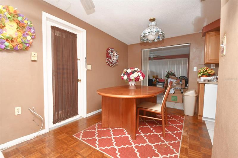 The dining room features wood laminate flooring.