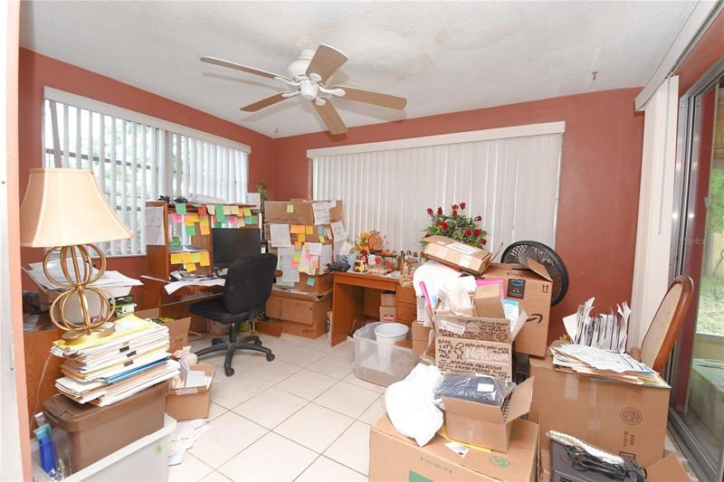 The Florida room has a ceramic tile floor, 2 large windows and a ceiling fan.