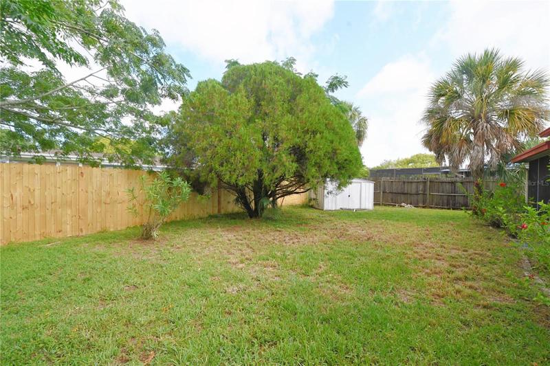The large backyard is perfect for family gatherings.