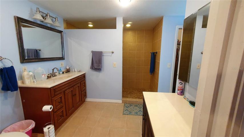 The owners suite bathroom is oversized with 2 vanities, 2 walk-in closets and a large shower
