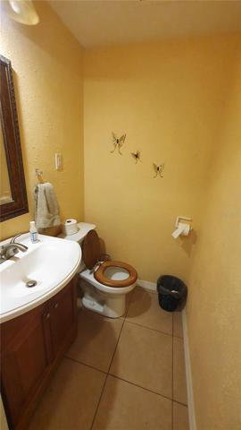 This half bath is a bonus and it's just off the kitchen