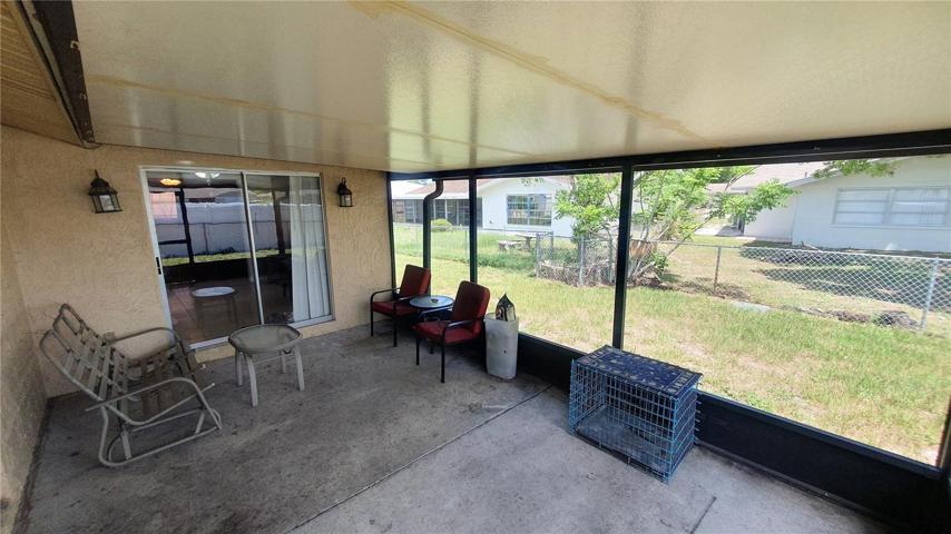 Relax on the screened patio (accessible from the game room and from the kitchen)