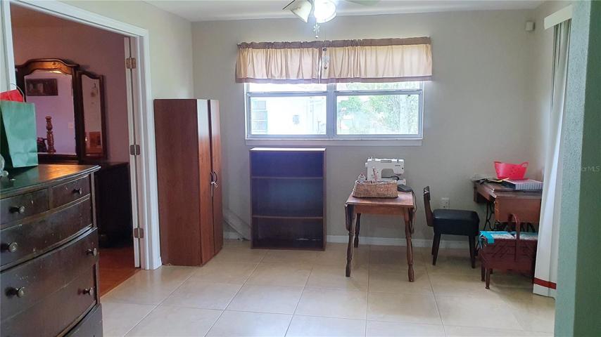This bonus space could have many uses (game room?) as it's adjacent to the owner's suite, the formal dining room and provides access to the screened patio