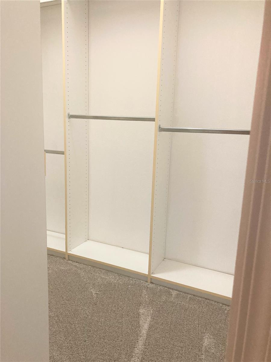 Master bathroom with tub and separate shower plus his/hers sinks.