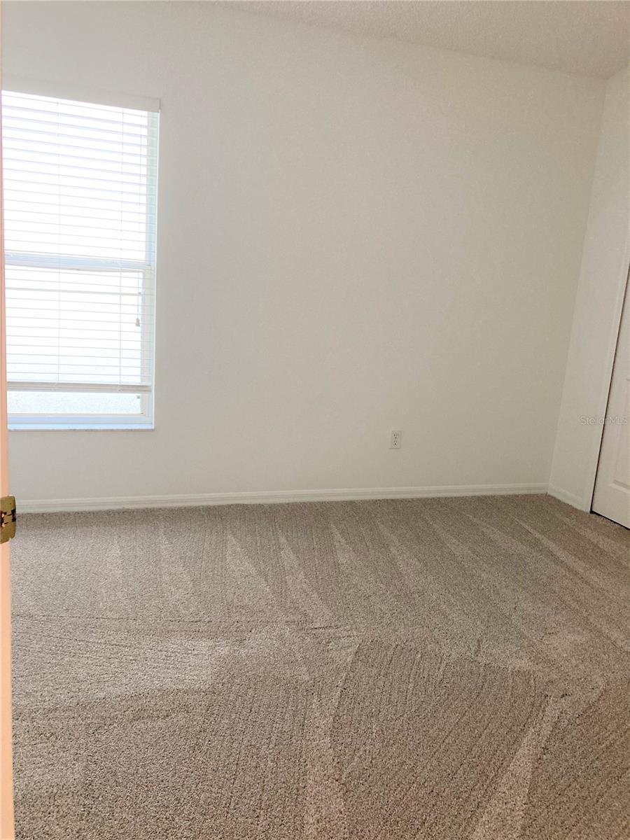 Walk in closet with organized closet system