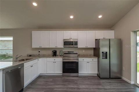 Kitchen with wall of cabinets