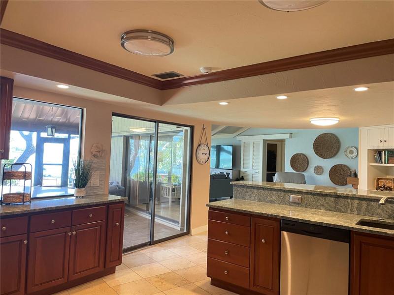 The kitchen opens to the pool.
