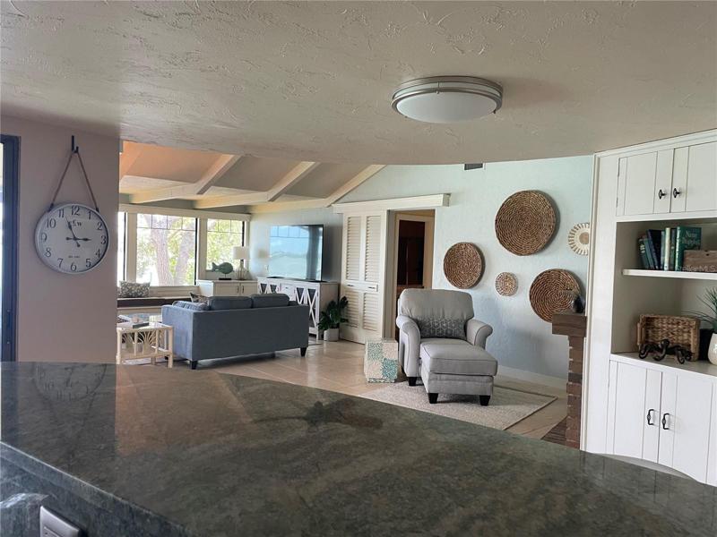 Looking to family room from kitchen service bar.