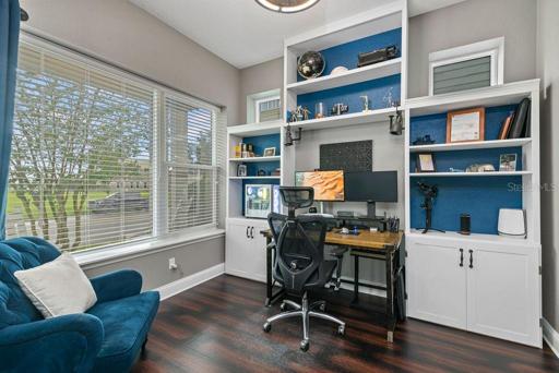 Office with Built-Ins and ample natural light.