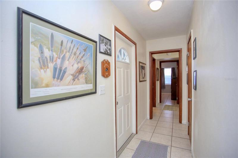 Hallway separates living area from bedrooms