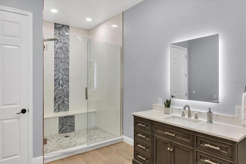 dual sinks and shower stall