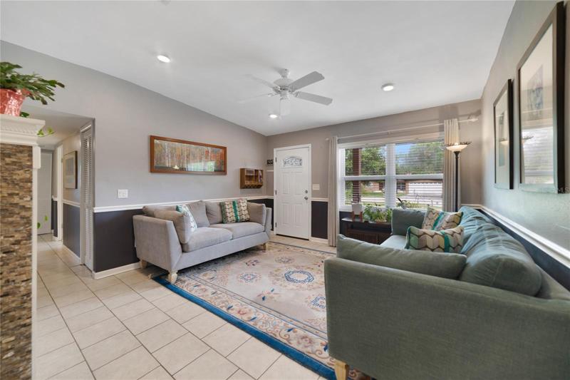 Start your tour in the bright living area with a cozy built in electric fireplace, flexible to use as a formal space or anything else your family might need!