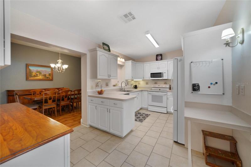 Follow the flow into the heart of this home and the updated kitchen offering quality appliances, ample storage in the many cabinets, solid surface counters and brand new WALK-IN PANTRY!
