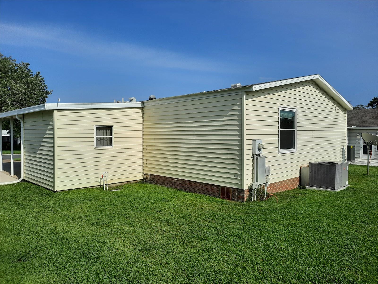 Side view with carport from back yard