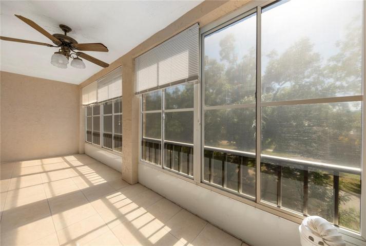 Lanai with a tree lined view