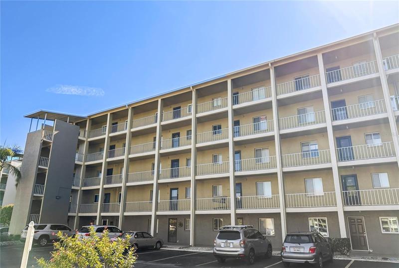Stairs on both the left side and right side of the building.  Elevator is to the right.