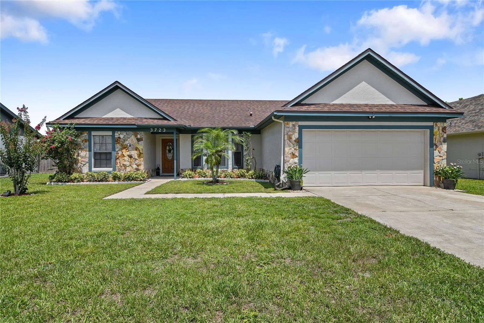 Front of home with fresh landscaping