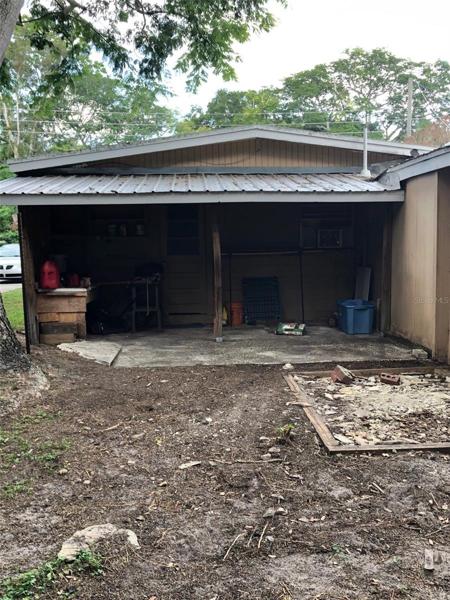 shop area, behind 2nd bedroom- has a door
