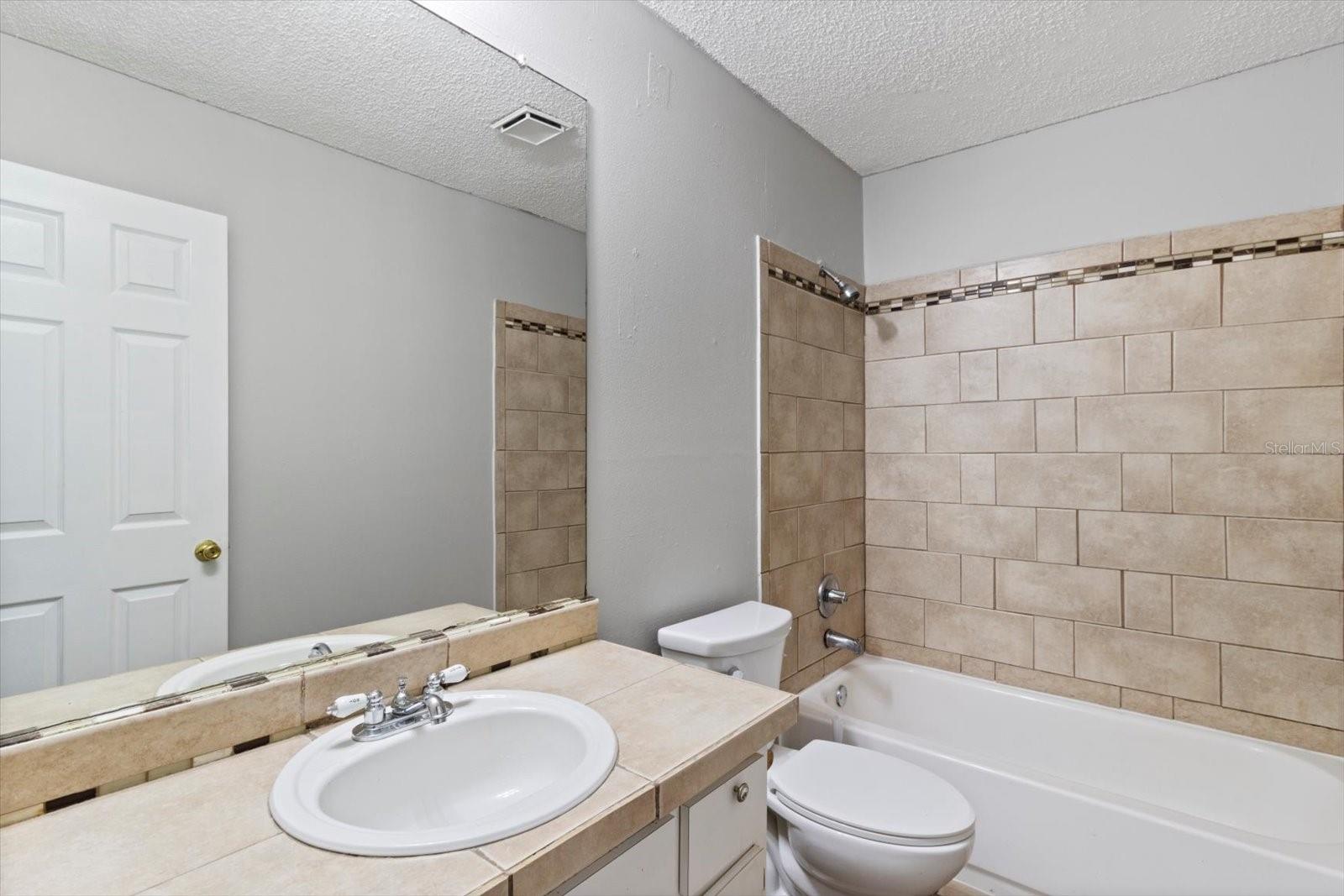 Guest Bathroom w/ Tub/Shower Combo &amp; Tile Surround