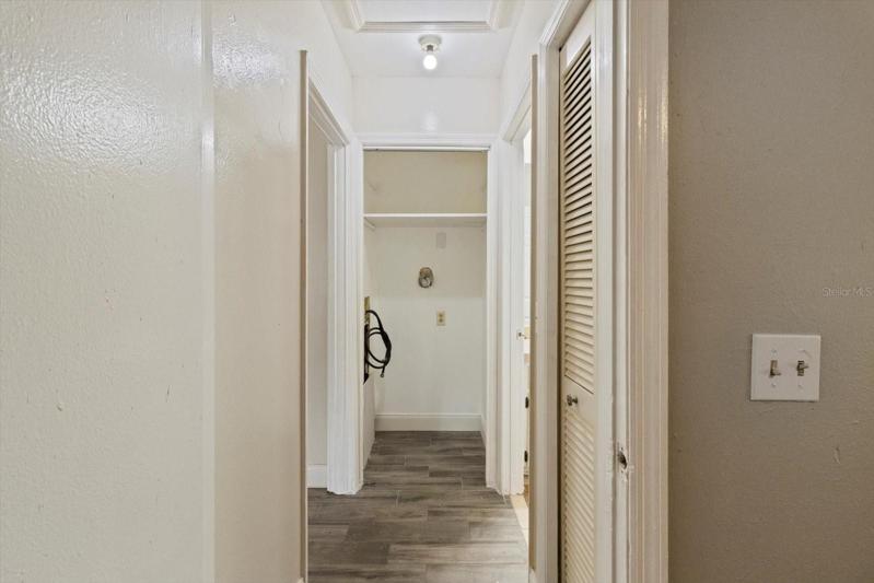 View from Guest Bedroom 1 into Hallway...Laundry Closet for Stackable Washer &amp; Dryer Straight Ahead