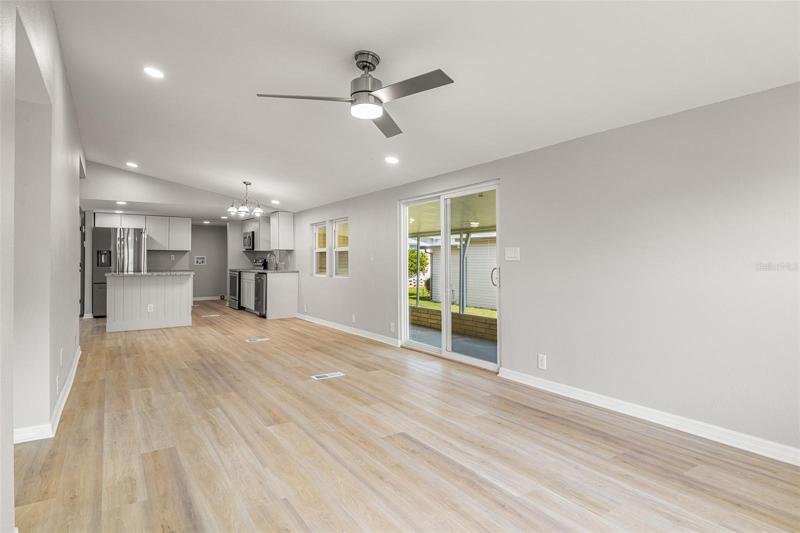 View from the living room toward the completely renovated kitchen with serving island.