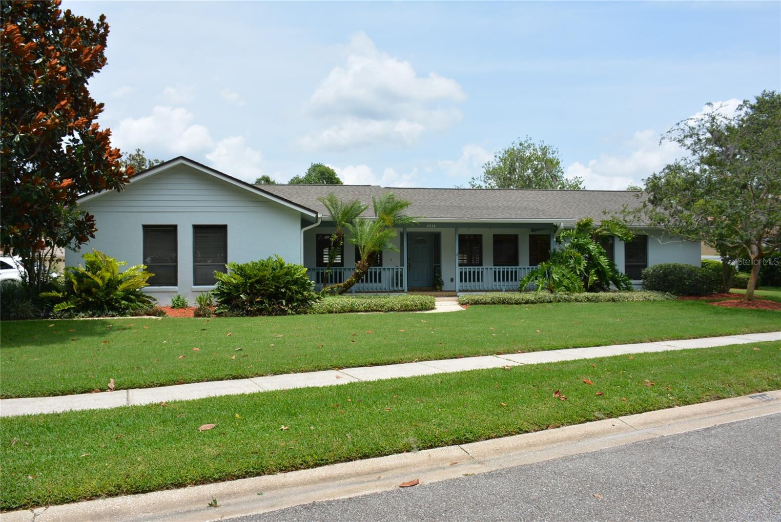 In a peaceful neighborhood on a quiet tree lined street in Quail Run at Bear Gully Lake, this home with excellent curb appeal sits on a corner lot with peaceful peak-a-boo views of the lake from the long & gracious covered front porch
