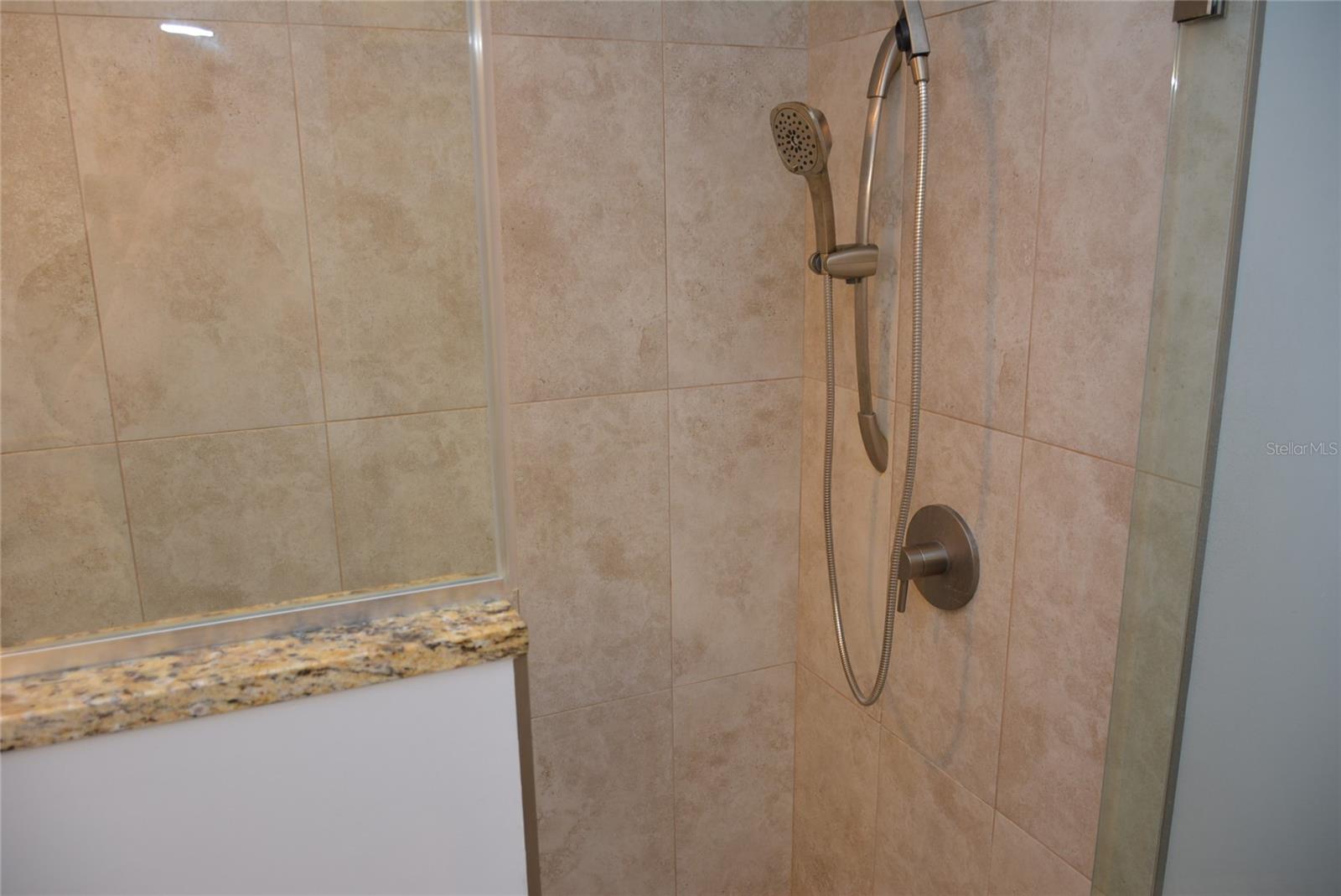 Step-in glass shower