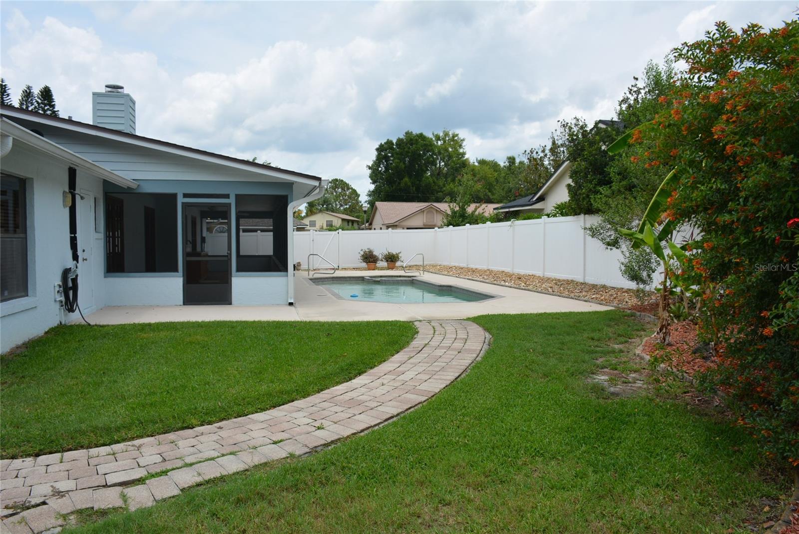 Extra-large (48’ x 10’) covered and screened lanai overlooking the open pool