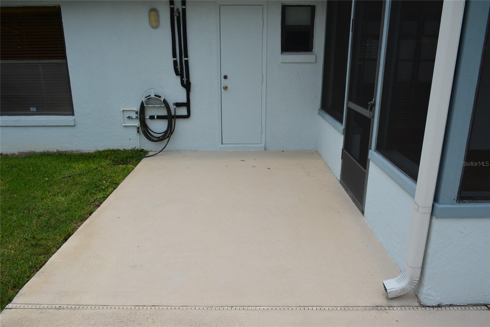 Large backyard with vinyl fencing and private open air deck for sunbathing