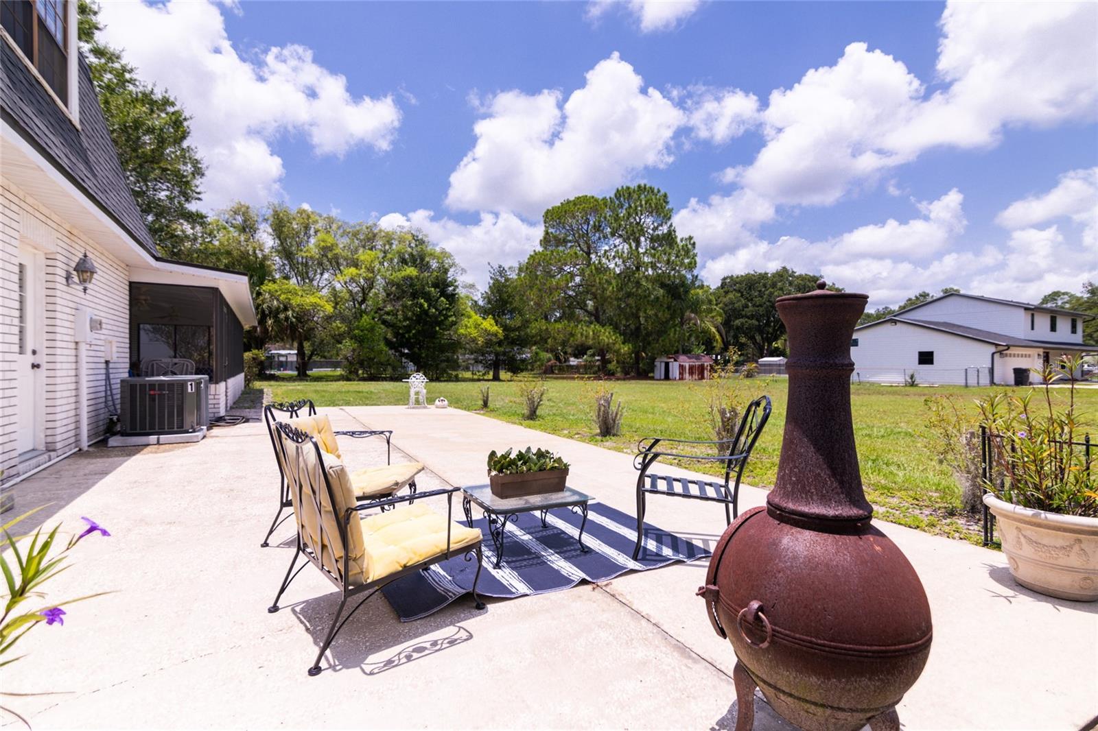 Large concrete patio in the backyard. Perfect for grilling!