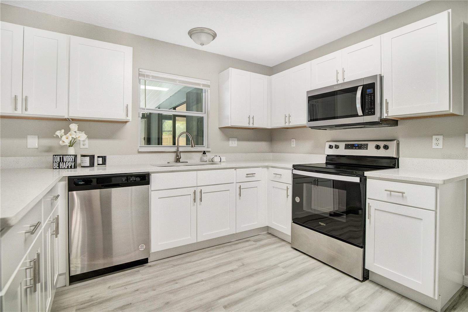 Updated kitchen with Silestone counter tops, newer stainless steel appliances.
