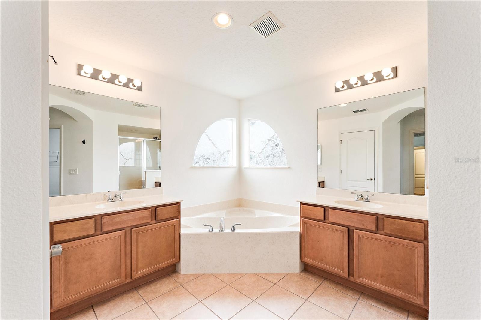 Master bath with garden tub, double vanities