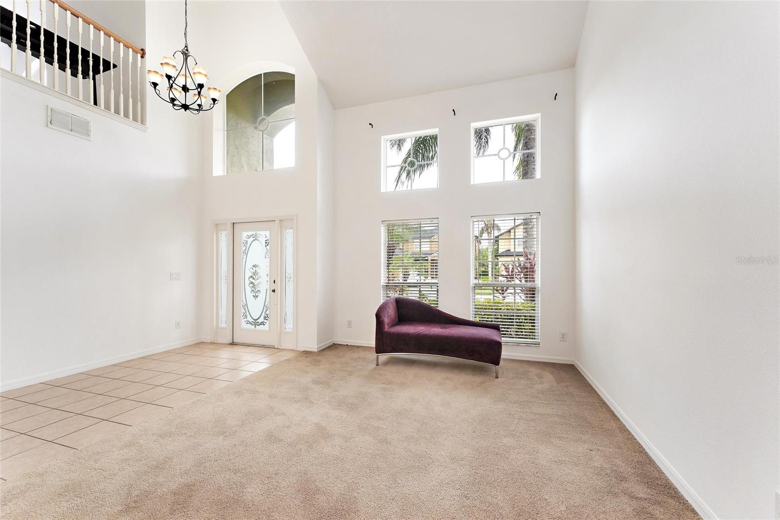 Formal living room and 2 story foyer