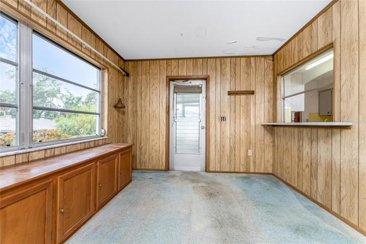 Florida room has a door to the screened lanai and a pass thru from the kitchen!