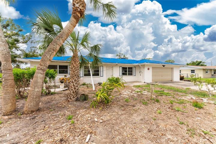 Tropical landscaping at front of home could be beautiful again!