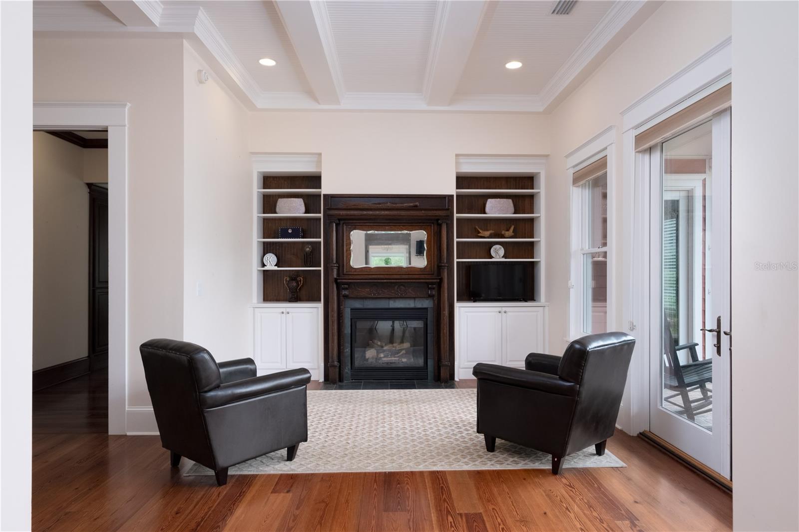 Downstairs owner's suite sitting room w/fireplace