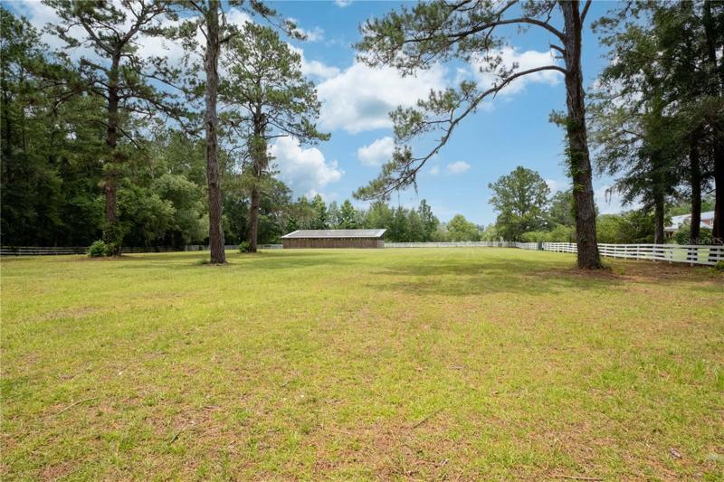 Fenced pasture w/Horse Stalls